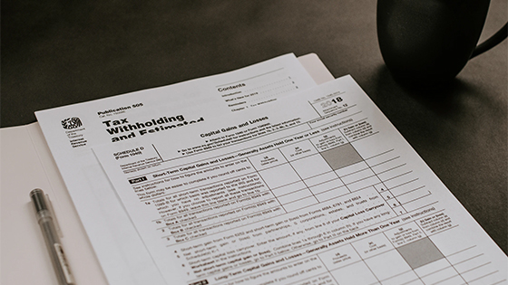 two documents with tax withholding information, possibly about series ee savings bonds