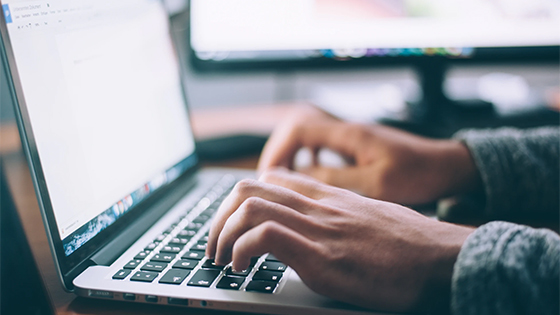 hands typing on a laptop; image used for a COVID-19 update about the Paycheck Protection Program (PPP) Loan Forgiveness Application hands typing on a laptop; image used for a COVID-19 update about the Paycheck Protection Program (PPP) Loan Forgiveness Application