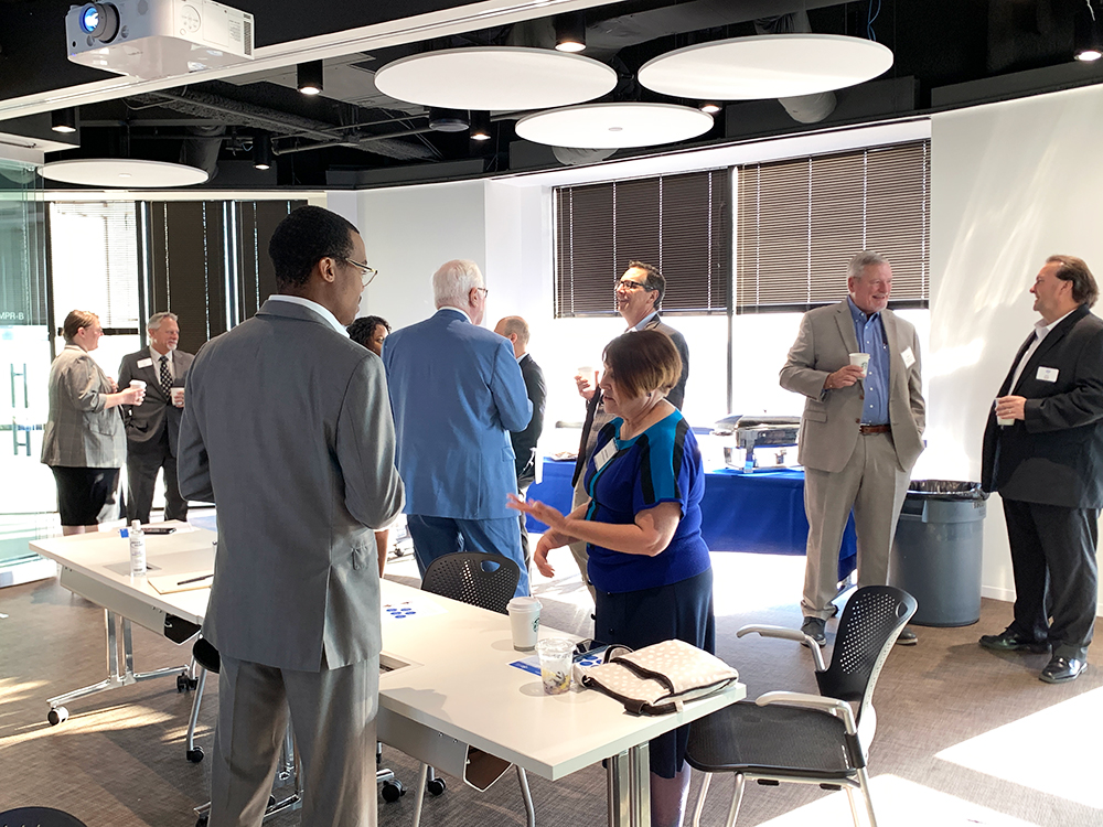 A photo of standing and talking for the PKF Texas seminar, "2022 Accounting and Tax Updates and Changes for Not-for-Profits"