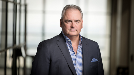 A professional headshot of Del Walker