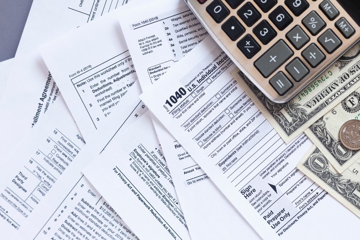 Assorted tax forms and IRS 1040 documents for recordkeeping